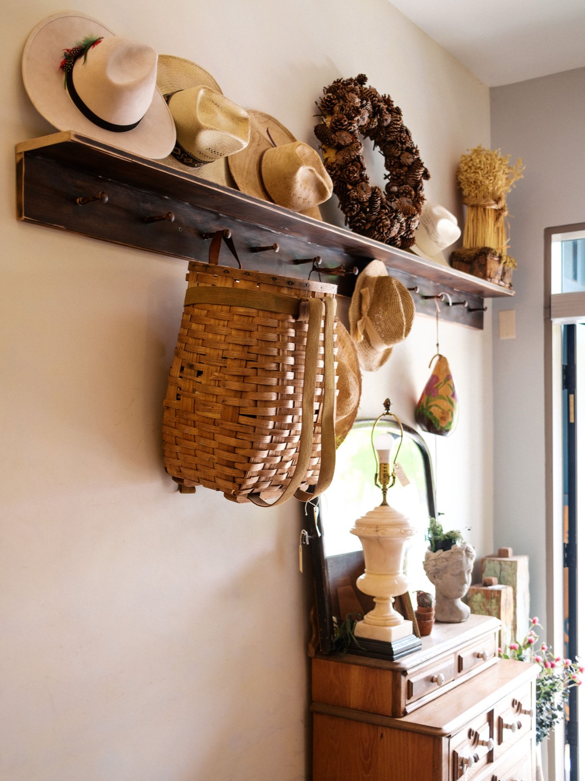 Vintage hats and woven baskets on display in the Antique Annex