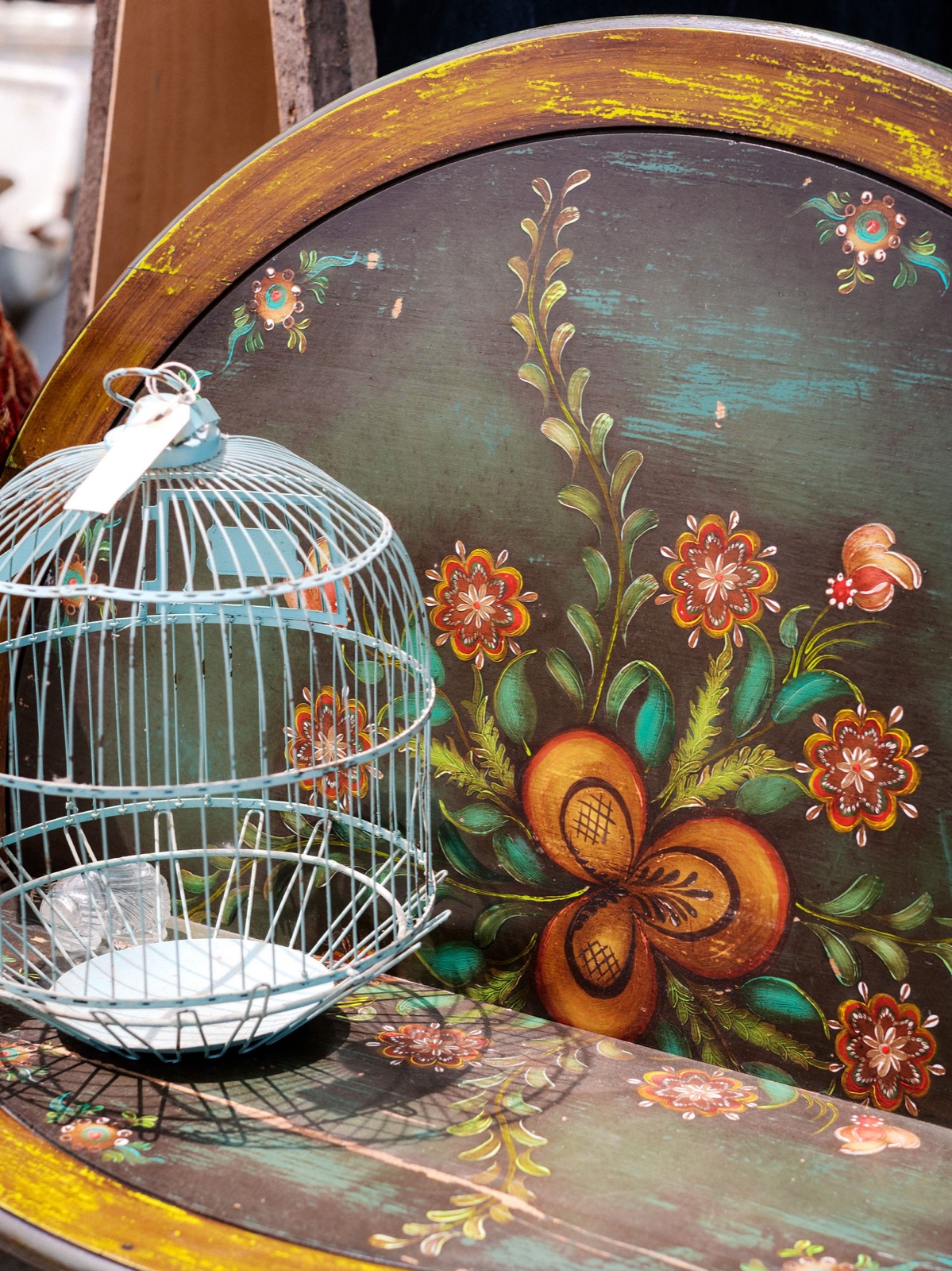 Hand-painted vintage tray and birdcage in the Antique Annex