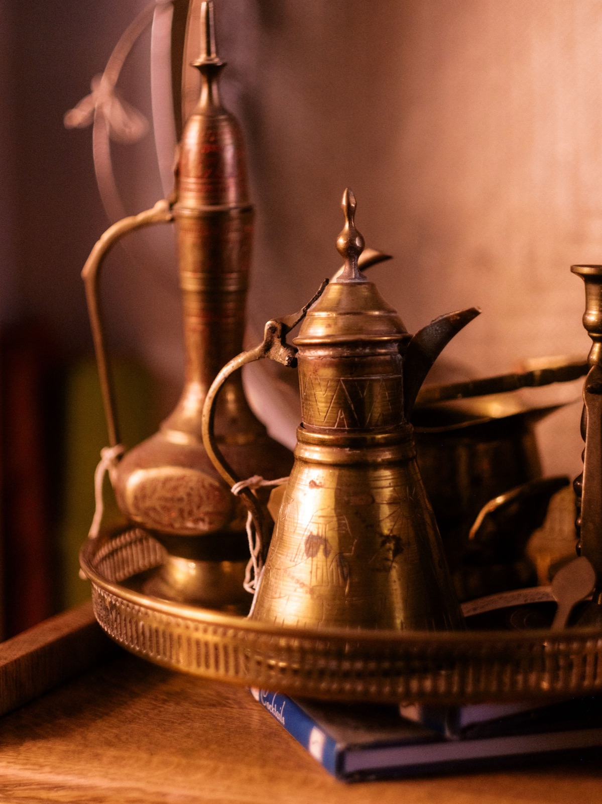 Brass Moroccan teapots displayed on a tray in the Antique Annex