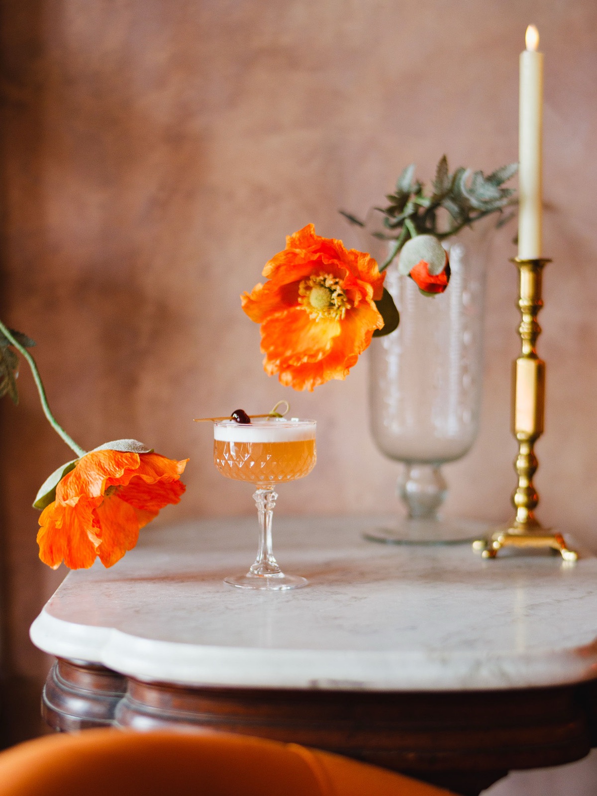 A hand-crafted cocktail with fresh orange poppies at Fiona's Bartique in Paonia, Colorado