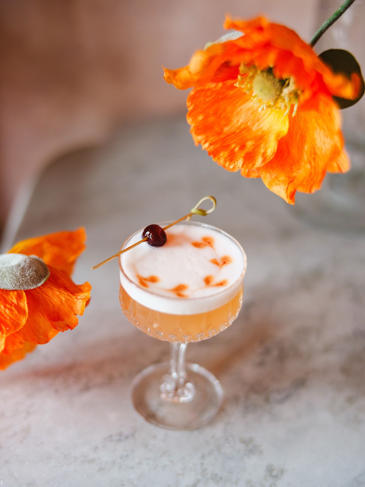 A hand-crafted cocktail on an antique side table inside Fiona's Bartique