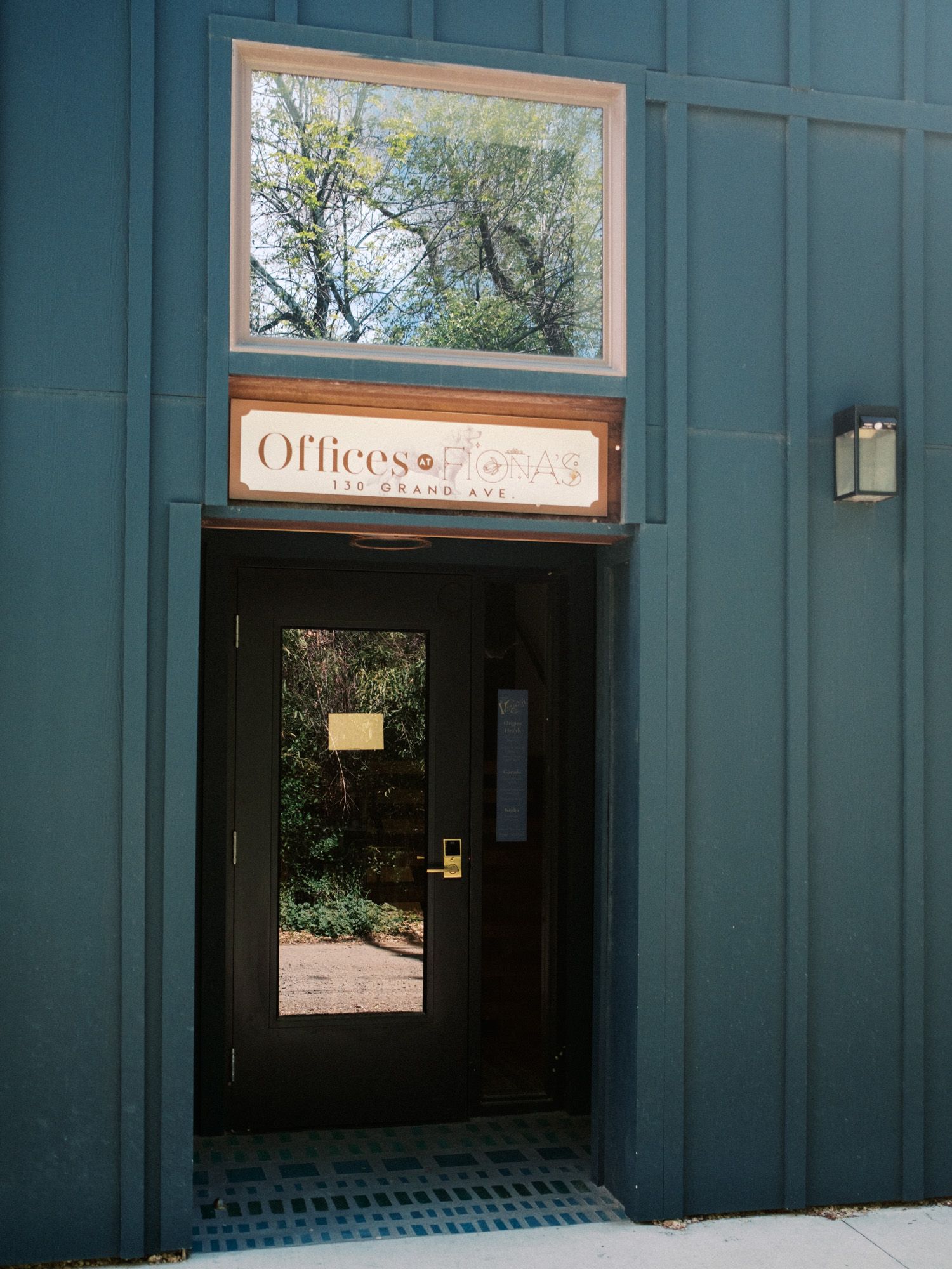 The antique-blue entrance to Offices at Fiona's, 130 Grand Ave